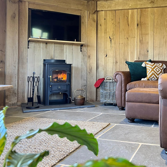 Stamford limestone floor tiles beneath a wood burning stove